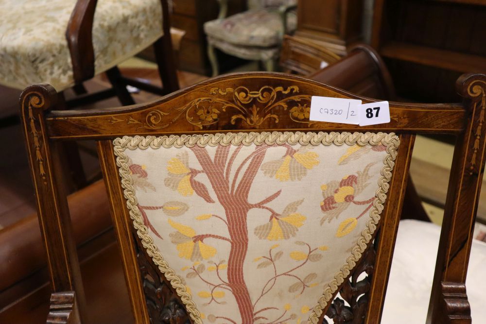 A late Victorian marquetry inlaid rosewood low seat chair